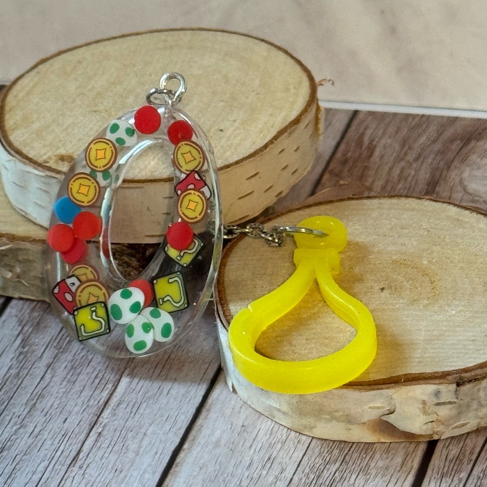 Letter O with video game inspired charms newly made.